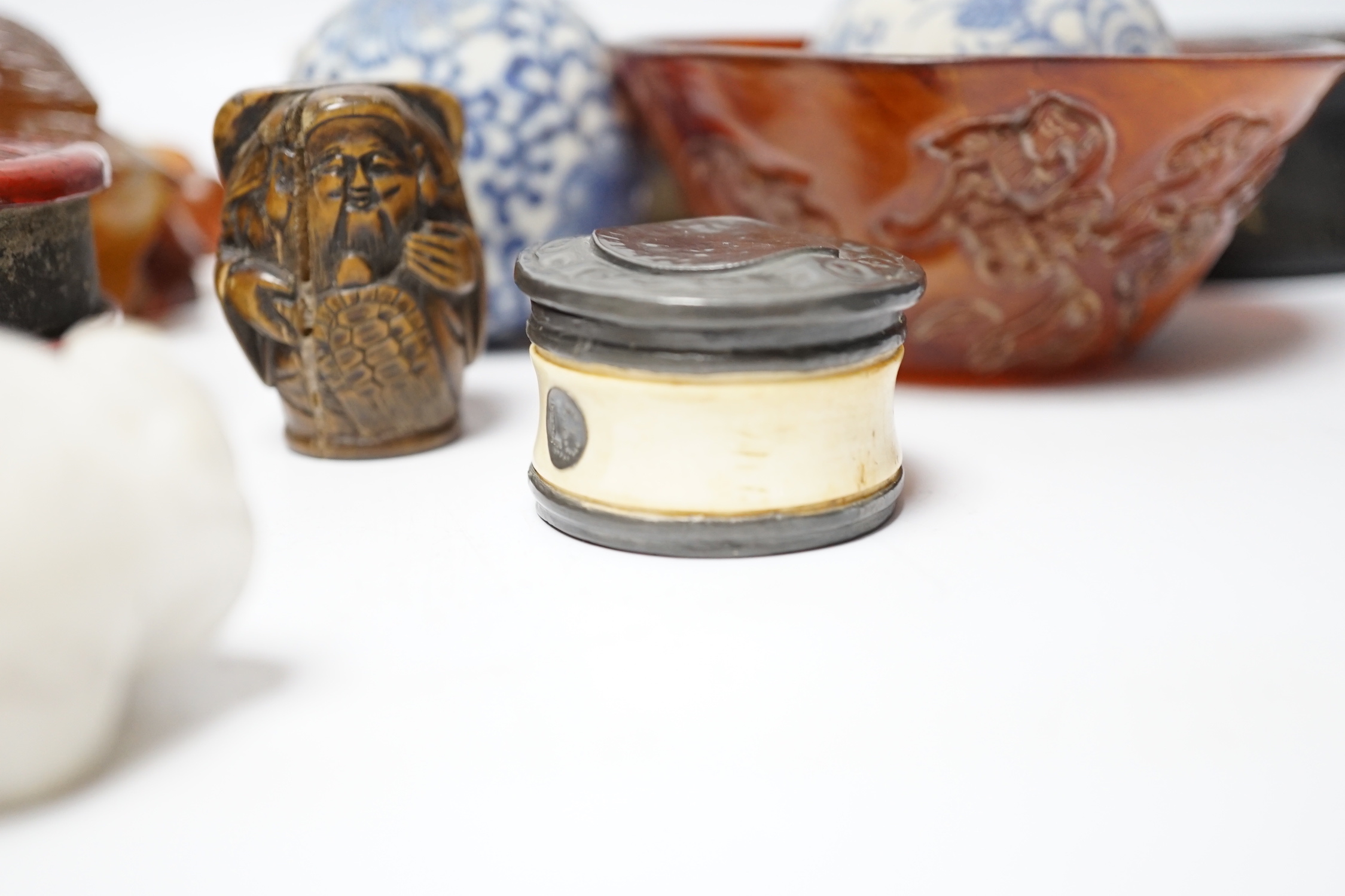 Eleven Chinese or Japanese items including; a bowl, a red lacquer box, an agate carving of a bird group, a carved hardstone lion tortoise, mother of pearl counters, etc.